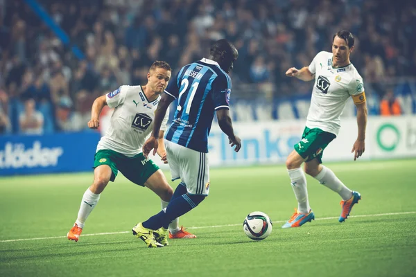 Mushekwi dribbling the ball at the soccer game between the rival