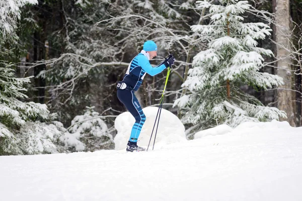Sideview of a ski runner at the event Ski Marathon in nordic ski