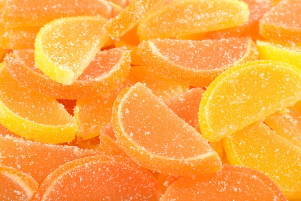 Orange and lemon candy slices close up