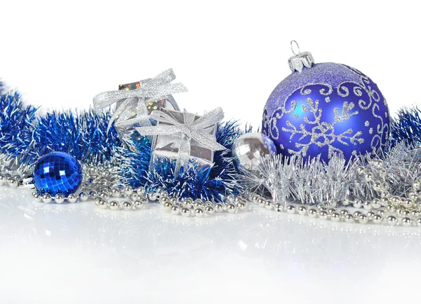 Blue and silver Christmas decorations on a white