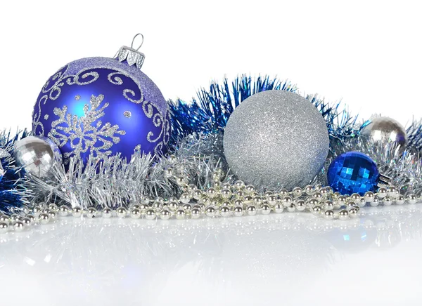 Blue and silver Christmas decorations on a white