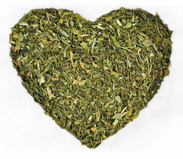Dried parsley in the form of heart on a white