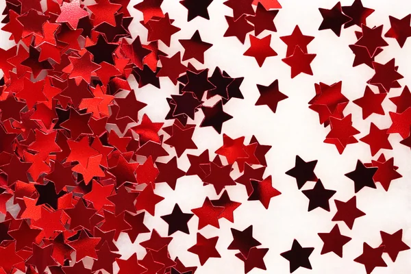 Confetti in the form of red stars background