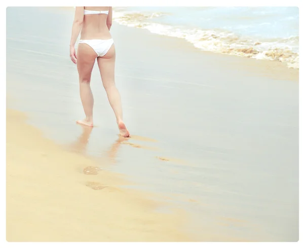 Woman wear bikini and having fun alone on the blue sea and hot sun Vintage pastel toned colors