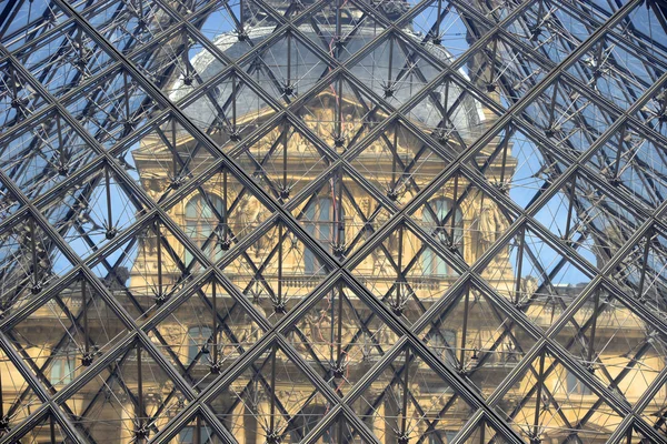 FRANCE, Paris 15 April 2015: Part of glass pyramid entrance to Louvre in Paris, France