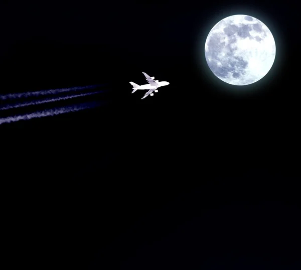 Airplane flies in direction moon at night