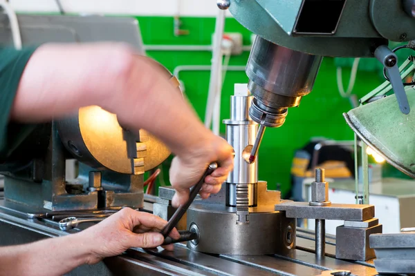 Blue collar worker working on industrial machinery