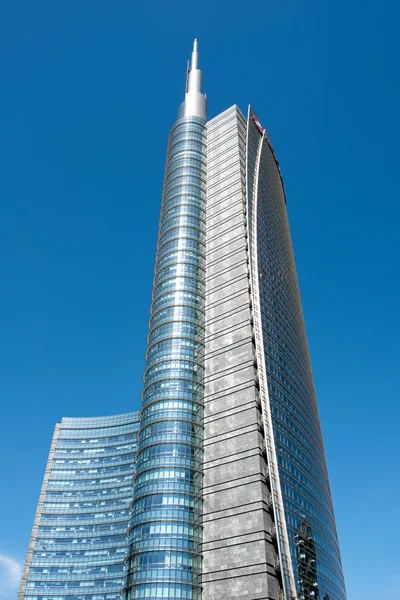 Tall skyscraper with sharp pointed tower in Milan