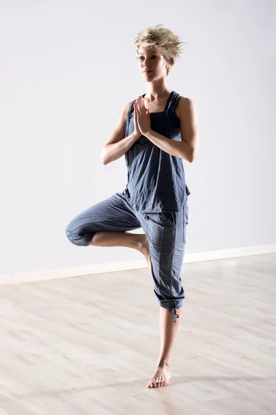 Woman balanced on one leg in yoga position