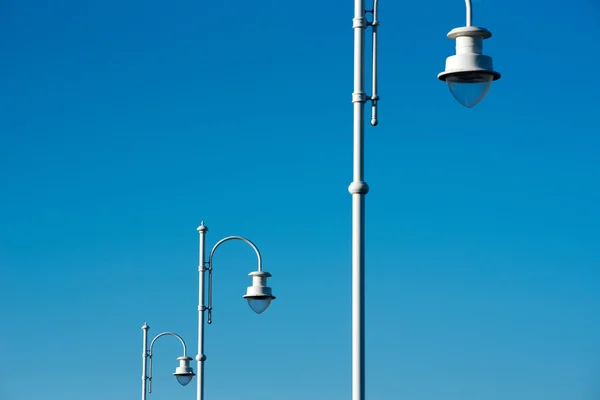 Row of modern style street lamps