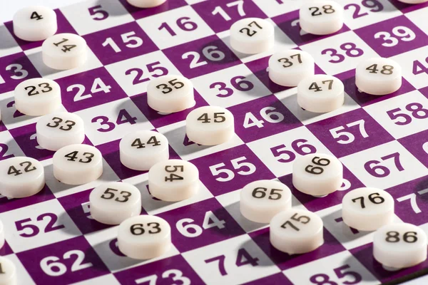 Plastic Bingo Numbers on Top of the Game Card