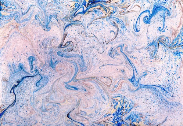 Swirling blue and white marbled paper