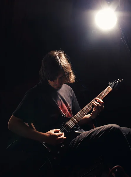 Young guitarist play guitar