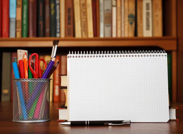 Open notebook with office stationery