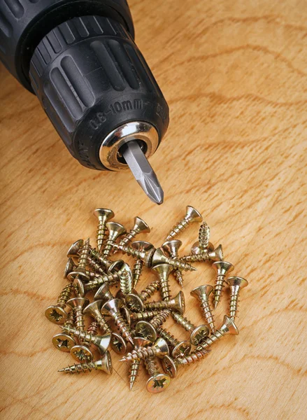 Electric drill and screws