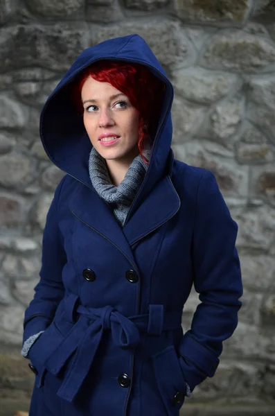 Redhead girl in blue coat