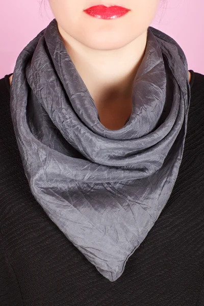 Silk scarf. Gray silk scarf around her neck isolated on white background.