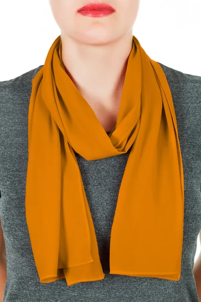 Silk scarf. Orange silk scarf around her neck isolated on white background.