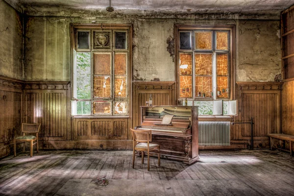 Old piano in an abandoned house