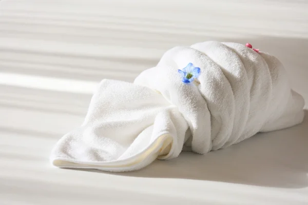 Creative towel on the bed in the hotel, towel set prepare for use in private room, equipment in rent room or hotel.