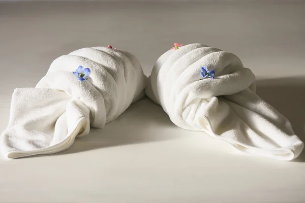 Creative towel on the bed in the hotel, towel set prepare for use in private room, equipment in rent room or hotel.