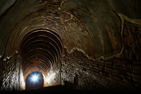 Tunnel background and business concept. tunnel with old brick. the end of tunnel and concept business successfully. mystery tunnel or mystery way. tunnel damaged and waited for repair.