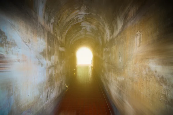 Tunnel background and business concept. tunnel with old brick. the end of tunnel and concept business successfully. mystery tunnel or mystery way. tunnel damaged and waited for repair.