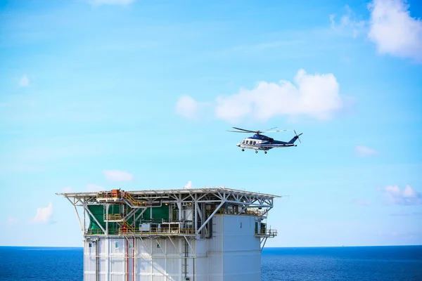Helicopter parking landing on offshore platform, Helicopter transfer crews or passenger to work in offshore oil and gas industry, air transportation for support passenger, ground service in airport.