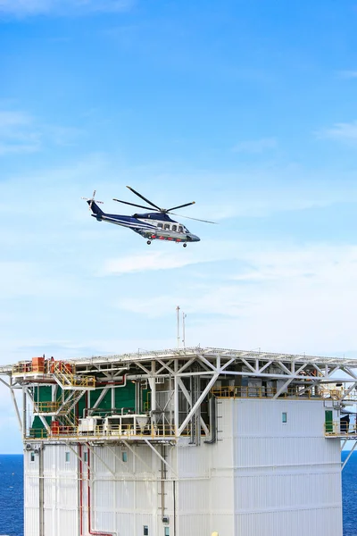 Helicopter parking landing on offshore platform, Helicopter transfer crews or passenger to work in offshore oil and gas industry, air transportation for support passenger, ground service in airport.