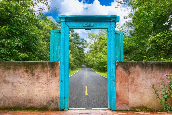 Vintage door with nature background and concept move out of the city to the nature for relax, Journey from the city to the nature for relax, Stop activity and go to nature with freedom of the life.