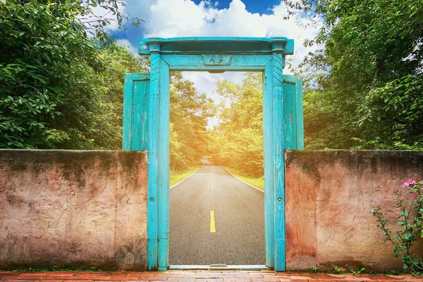 Vintage door with nature background and concept move out of the city to the nature for relax, Journey from the city to the nature for relax, Stop activity and go to nature with freedom of the life.