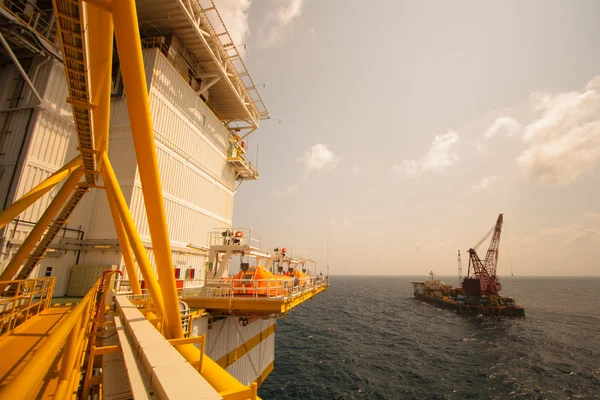 Large crane vessel installing the platform in offshore,crane barge doing marine heavy lift installation works in the gulf or the sea