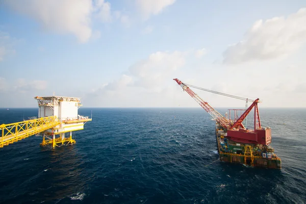 Large crane vessel installing the platform in offshore,crane barge doing marine heavy lift installation works in the gulf or the sea