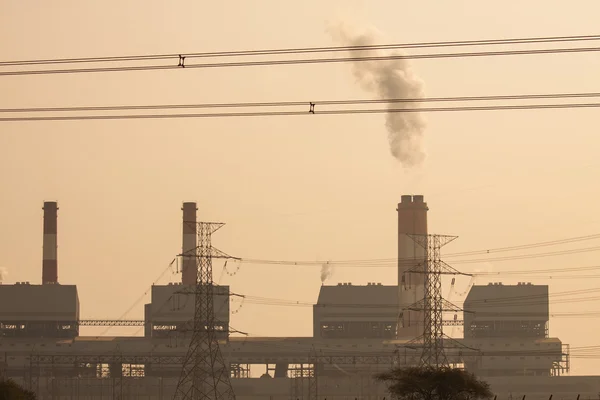 Industrial power plant with smokestack, the power plant production on hot condition in the mountain.