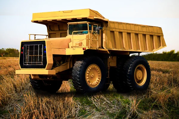 Heavy mining truck in mine and driving along the opencast. Photo of the big mine truck, The career heavy-load super car.