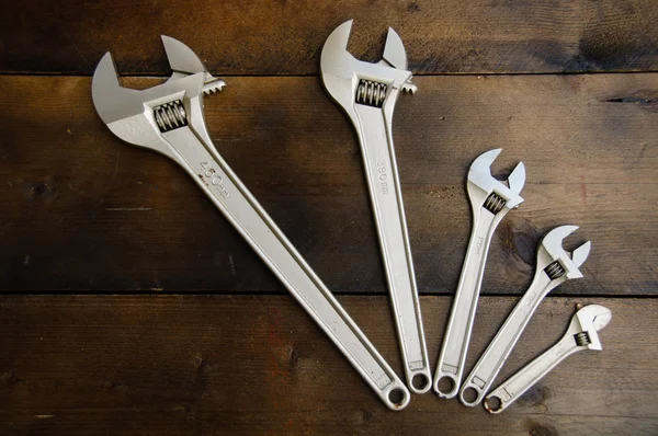 Spanner or adjustable wrench on wooden back ground, Basic hand tools.