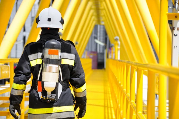 Fire fighter on oil and gas industry, successful firefighter at work