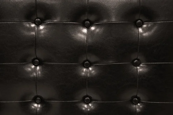 Modern black leather sofa isolated against white background, Interior building set in room.