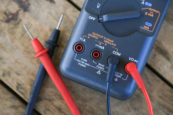 Close-up of digital multimeter on wooden background, Worker used electronic tools for checked circuit, Special tools on electronic job.