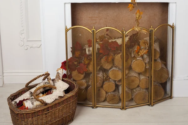 Artificial fireplace logs with white and gold bars