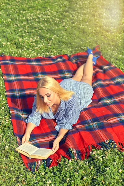 Top view woman relaxing outdoors with a book