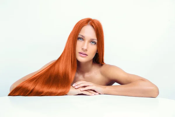 Fashion model with long red hair