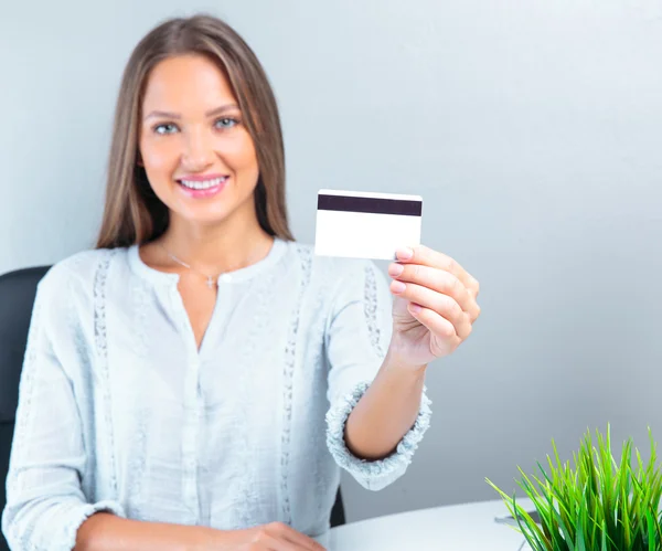 Business woman holding credit card