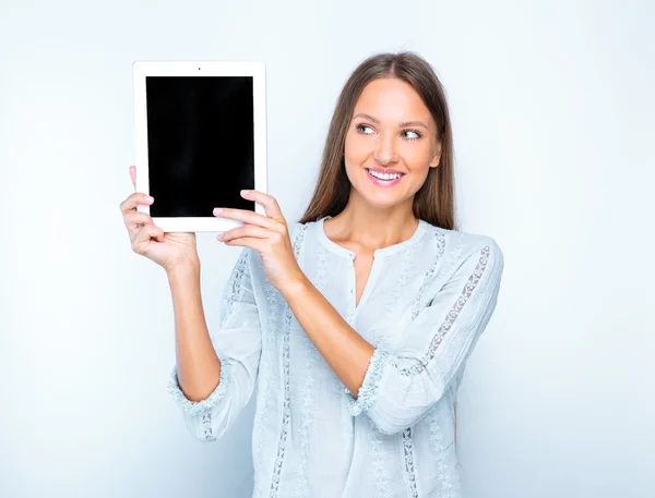 Smiling woman with tablet