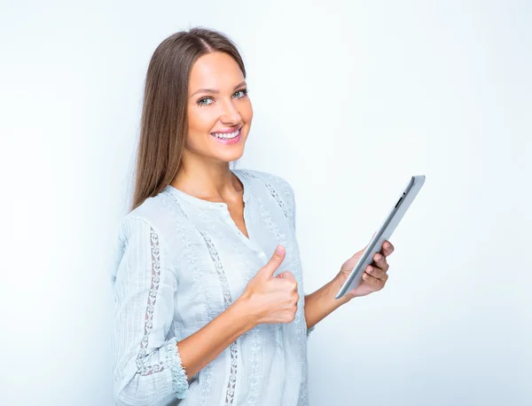 Smiling woman with tablet