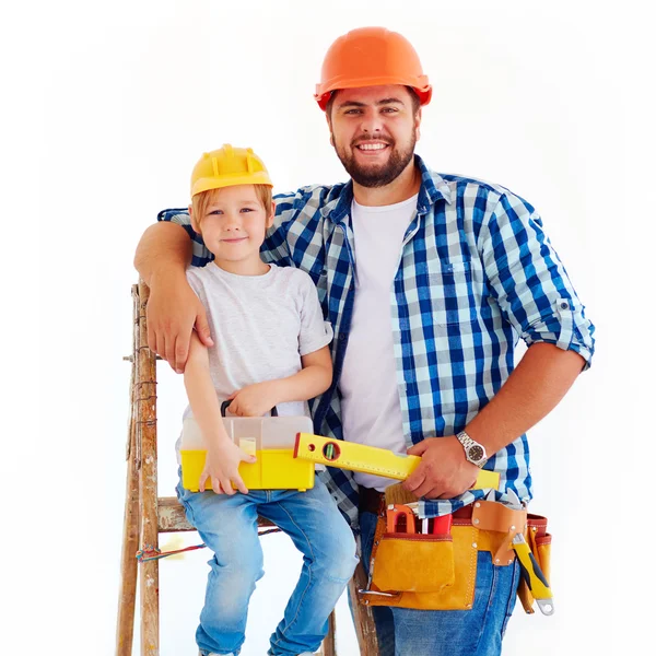 Happy father and son ready to repair a house