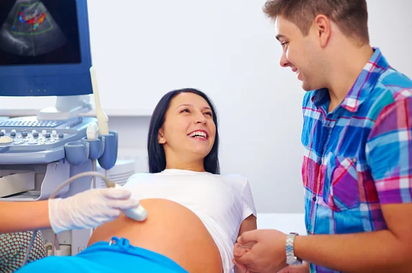 Happy couple on ultrasound, determines the gender of child