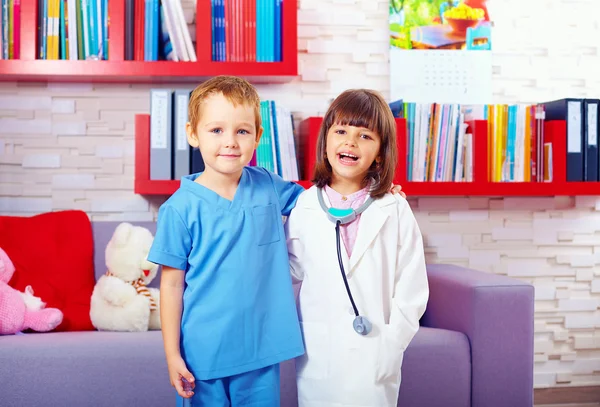 Portrait of cute kids playing doctors