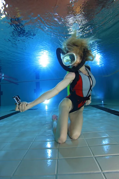 Female scuba diver with camera