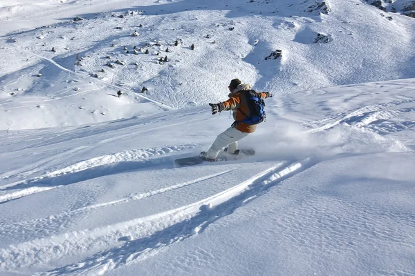 Snowboarder in powder snow